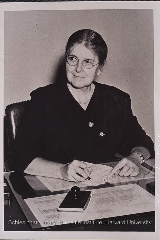  Martha May Eliot seated at her desk