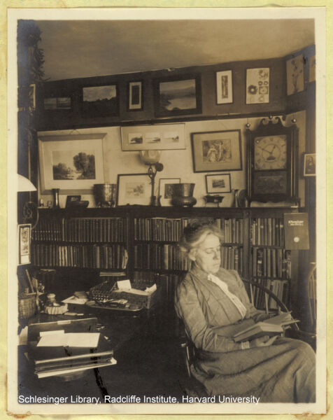 Portrait of Alice Rich Northrop sitting in her office, reading