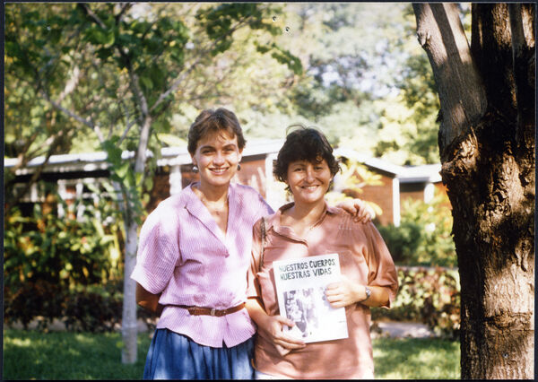 Two images of women holding copies of Nuestros Cuerpos, Nuestras Vidas they delivered and donated to organizations in Nicaragua on behalf of BWHBC
