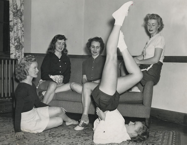 Boston YWCA members demonstrating posture and stretching exercises