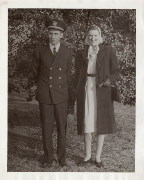 Portrait of Flo and Ted Bouna[?] outdoors; he is in navy uniform