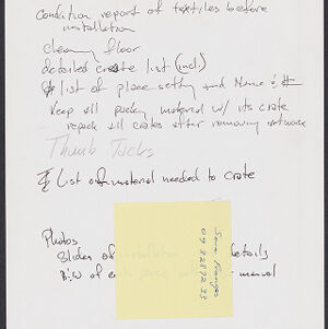 Handwritten note partially obscured by a yellow sticky note with handwritten annotations