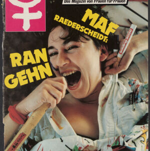 Emma magazine cover with a woman smiling and opening her mouth while holding art supplies