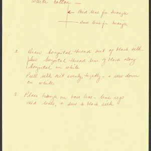 Handwritten notes and diagram in red on yellow paper