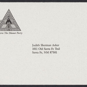 Printed, addressed envelope with a diagram of an upward-pointing triangle filled with geometric designs in the upper left corner