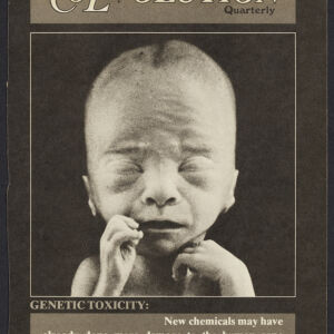 Black-and-white printed cover of CoEvolution Quarterly with a photograph of an infant's face with eyes closed