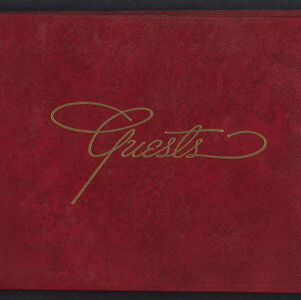 Cover of a guestbook with gold lettering on burgundy