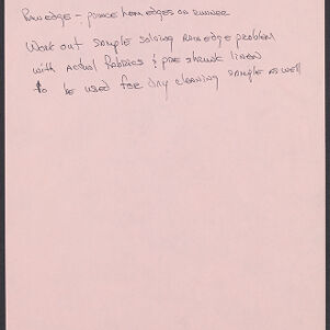 Handwritten note in black ink on pink paper