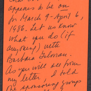Handwritten note in black ink on orange paper
