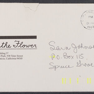 Printed envelope with stamp and postmark and handwritten address in black ink