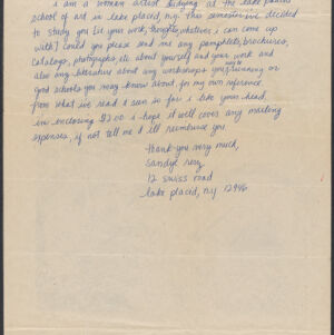 Handwritten letter in blue ink on beige paper