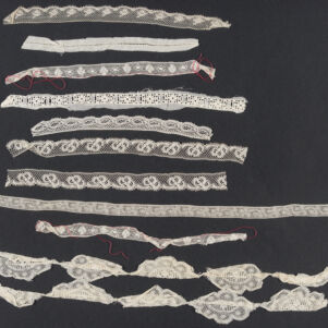 Ten different strips of white lace arranged in horizontal rows