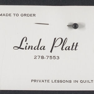 Printed business card in black ink on white paper