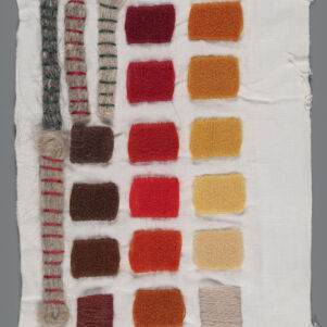 Fifteen embroidery samples in various colors on white fabric