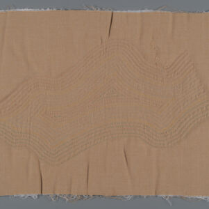Light brown fabric with multicolored stitching forming a wavy, abstract shape