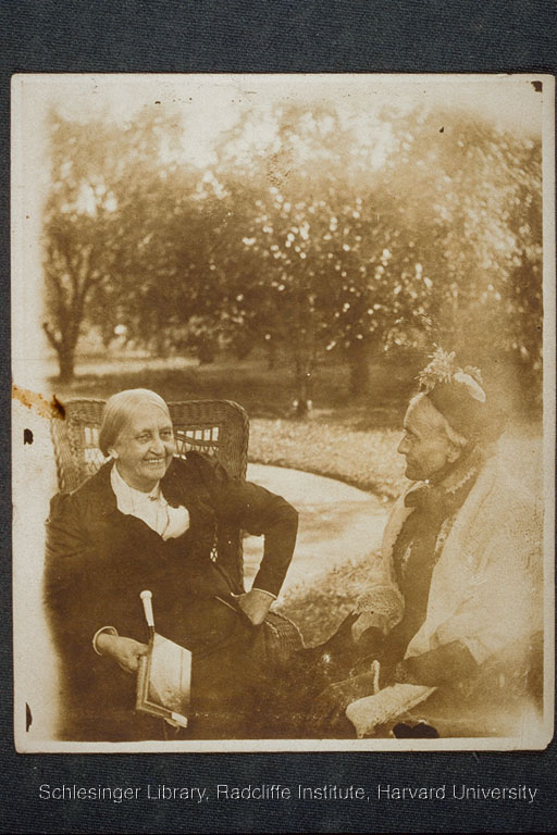  Susan B. Anthony and Jean Greenleaf smiling, outdoors.