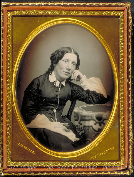 Portrait of Harriet Beecher-Stowe in a gilded frame.