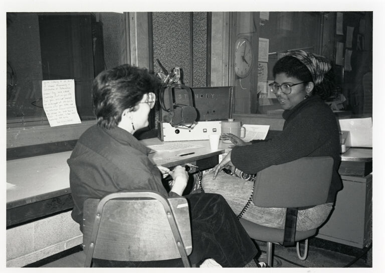 Two women talking in the radio studio at WMBR-FM, the student radio station licensed to the Massachusetts Institute of Technology, during the annual International Women's Day radio program
