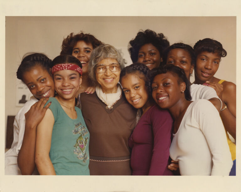 Group protrait of Rosa Parks and her 8 granddaughters.