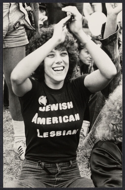Woman at a protest wearing a t-hisrt that reads "Jewish American Lesbian." 1979