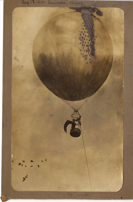 Margaret Foley in hot air balloon distributing suffrage pamphlets, 1910.