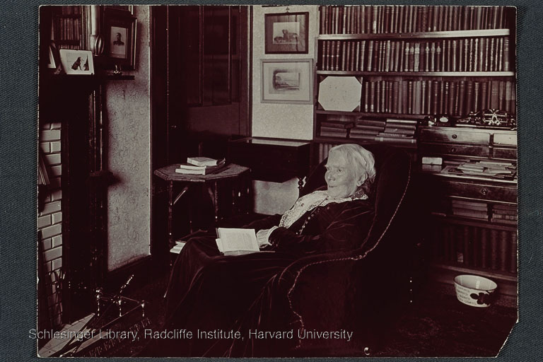  Elizabeth Blackwell seated in front of her study fireplace, an open book on her lap.