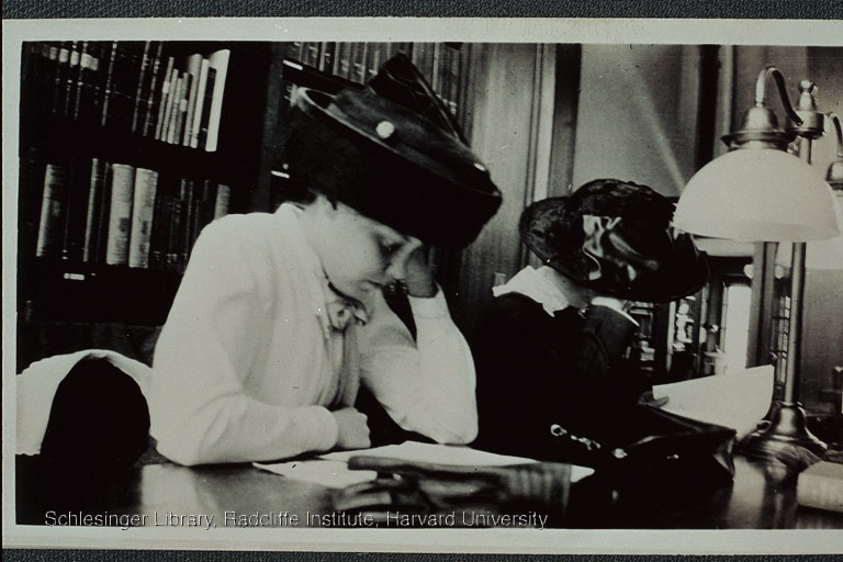 Mary Burrage and a second Radcliffe student studying in a library
